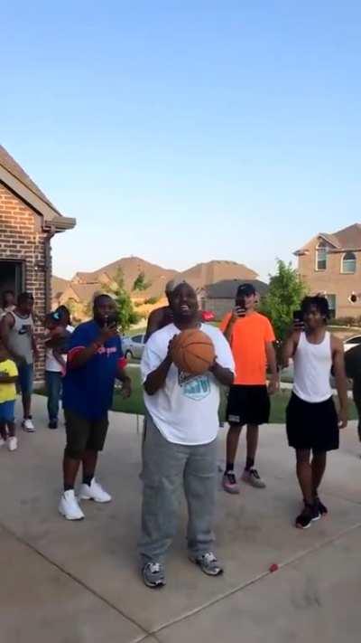 An uncle, who is blind, attempts a free throw. He realizes that he made it when his family starts cheering, and celebrates afterward