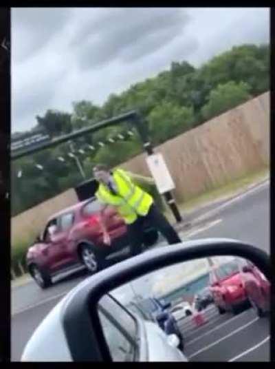 Drive thru employee dances to music coming from a car in line