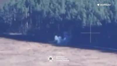 Russian soldiers tried to extinguish their positions after beeing attacked by Ukrainian drones operated by a Border Guard unit. October 2024. Northern Kharkiv region.