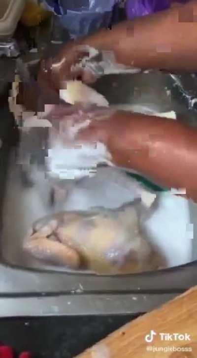 Washing chicken in dish soap