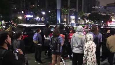 Protesters protesting the death of an armed robber in San Diego, CA attack a man holding a puppy for disagreeing with their protest. The protester &quot;medics&quot; then scream at the cameraman to stop filming while the assailant runs away.