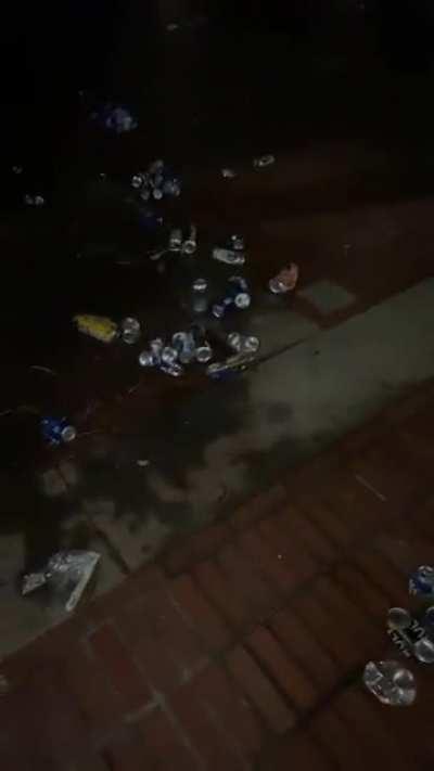 Littered cans by the Campanile