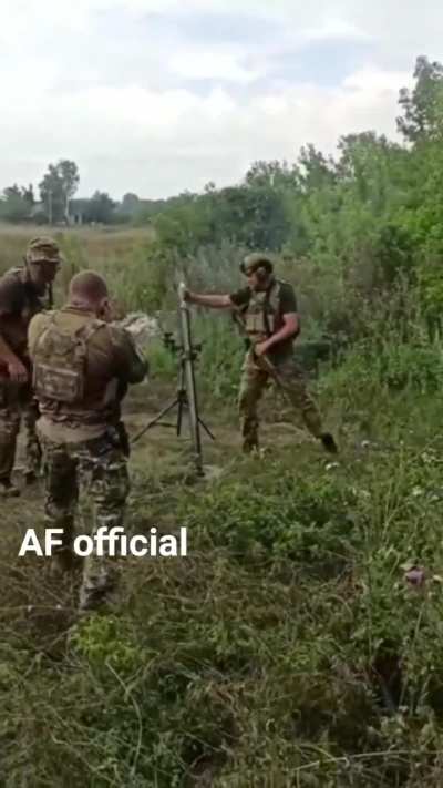 A Ukrainian 60mm mortar team rains down projectiles on a Russian position.