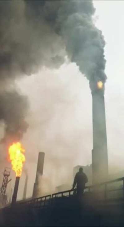 Lighting a smoke stack with a torch