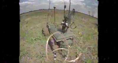 FPV drone hits a Ukrainian UGV which seems designed to collect or dispose of something