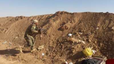 Iraqi PMU fighters take turns blinding firing at IS lines before incoming firing dampens the mood - Mosul, Iraq - 2017