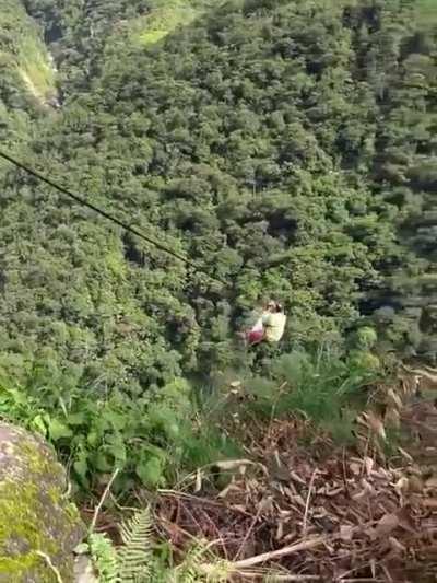 2 towns in Colombia linked by zlpline. Everything from food to small animals and children are transported across the 800m cable