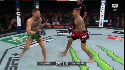 Dustin Poirier cracks Conor McGregor with a clean combo, forcing McGregor to once again turn into a NCAA wrestler