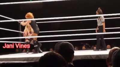 Becky stomps on Alexa’s belly and chokes her with her boot at the WWE’s live show at Fort Wayne.