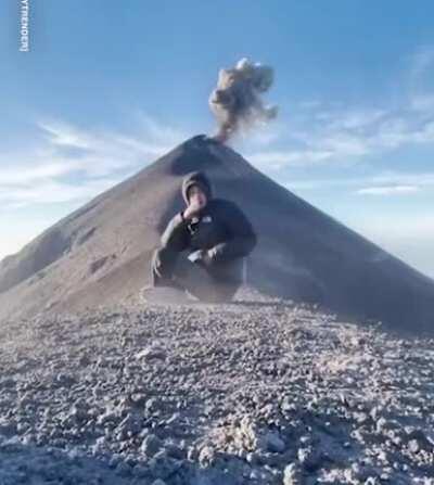 A young man captured the moment the Fuego volcano in Guatemala erupted when he meditated in front of it.