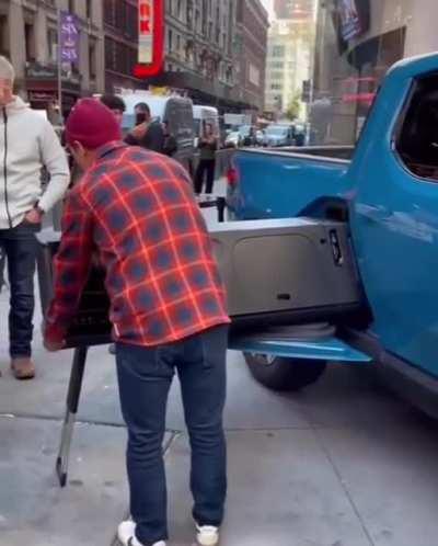 This rivian truck that comes with a portable kitchen.