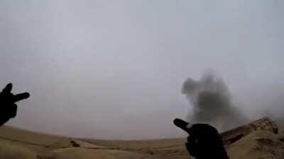 A Kurdish fighter has an interesting reaction to ISIS artillery landing close by.