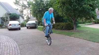 This father showing his daughter how to do a Candy Bar Pedal Picker.