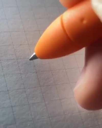 The way that the person writes with their pen