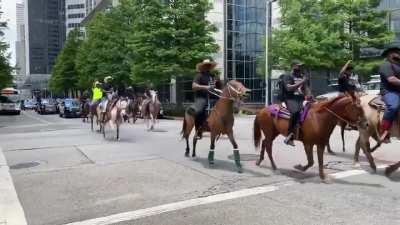 The Rohirrim for George Floyd ride to a peaceful demonstration with an escort from the Houston police