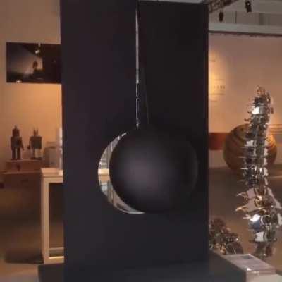 The way this pendulum artwork illuminates as it goes back and forth.