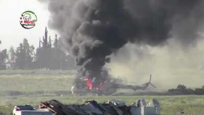 Syrian rebels claim the destruction of an SAA helicopter with a truck mounted ZPU-2 AA gun - Menagh Airbase - 5/21/2013