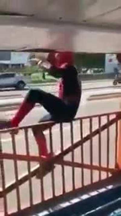 Spiderman wallruns a bus.