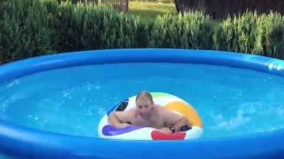 Riding on waves in a round swimming pool