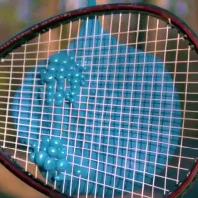 Water balloon versus tennis racket