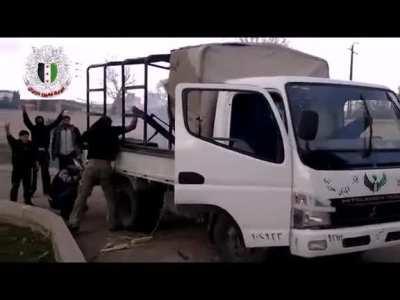 Ababil Houran Brigade fighters run a mortar out of the back of a Mitsubishi - E. Ghouta - 2012