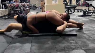 Hot Latina in bikini puts Gringo in Reverse Headscissor hold at the gym while strangers watch - full clips and more at kinksports.com