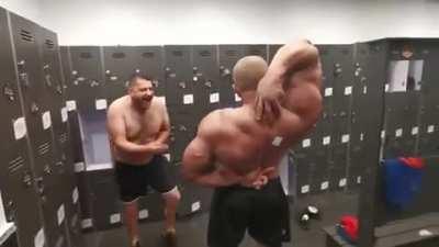 Bodybuilder can't reach a sticker on his back