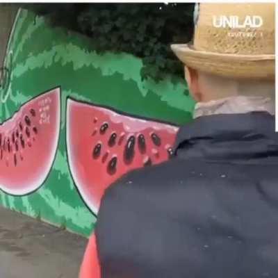 Man in Italy covers racist graffiti with works of art