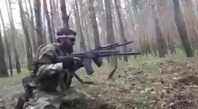 'Chechen fighter with two AK-74 in the forests of Luhansk'