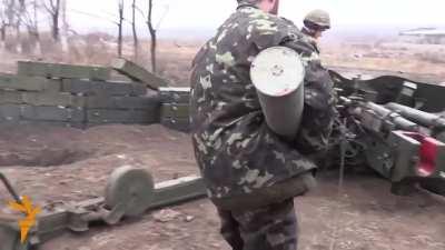 Ukrainian Troops operating an MT-12 anti tank gun and mortars against DPR positions. Filmed in Pisky, just outside of Donetsk Airport (30/11/14)