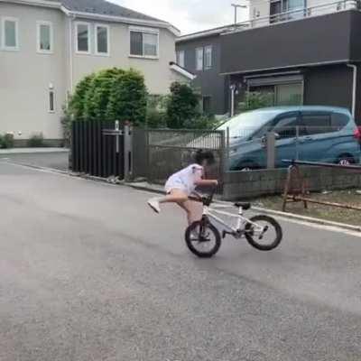 This little girl's biking skill.