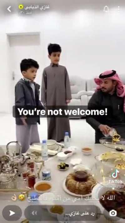 Arab boy yells at his father's friends to defend his mother.