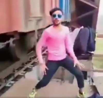 dancing beside a train