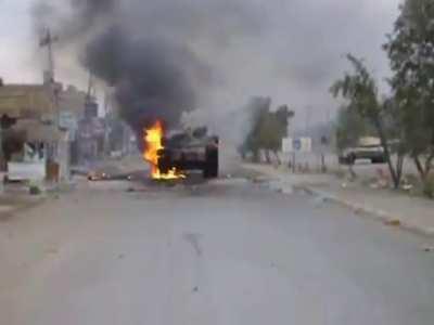 Two USMC M1A1 Abrams hit by IEDs, one of which is destroyed. January 5, 2007.