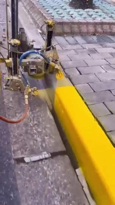 Applying paint to a curb