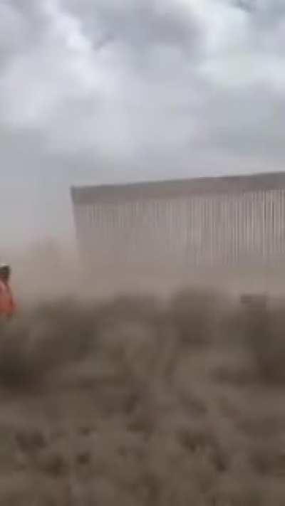 Hurricane Hanna blowing over Trump’s mighty border wall between the United States and Mexico....