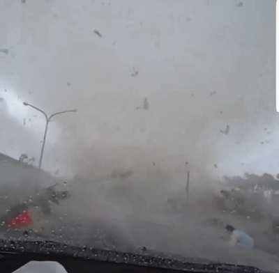 Tornado eating a car