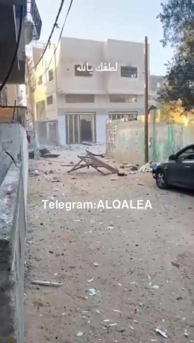 Photographer has a close call. IDF missle strike comes screaming in. Location: Gaza strip. 