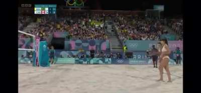 After an argument between beach volleyball athletes at the Olympics, the DJ lightens the mood.