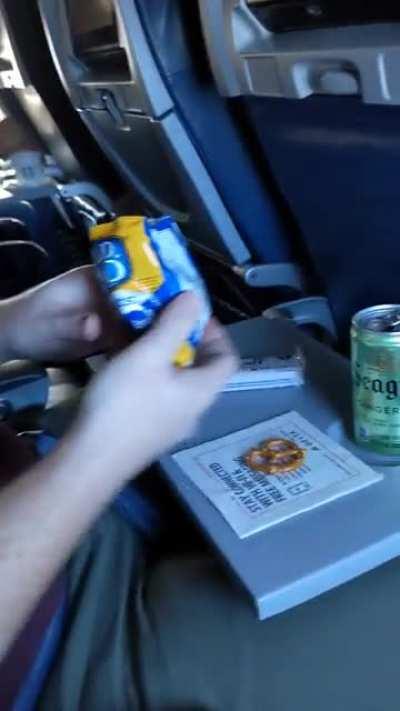 Enjoying a snack on an airplane