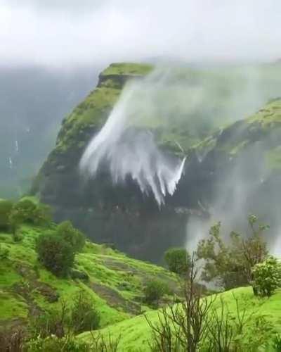 Strong winds causing this waterfall to spray upwards