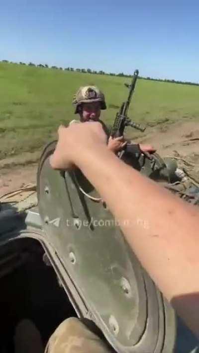 Ukrainian troops return from the front with captured Russians aboard a BMP-1. Location unknown- July 2024