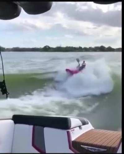 Kayaking in a boat's wake