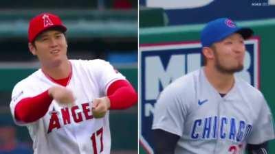 Shohei Ohtani catches Seiya Suzuki with his fishing rod during pregame warmup