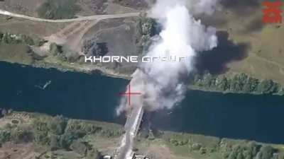 Drone footage by the Ukrainian &quot;Khorne group&quot; shows another attack on a Russian bridge over the Seym river. Near Karyzh, Kursk Oblast, Russia.