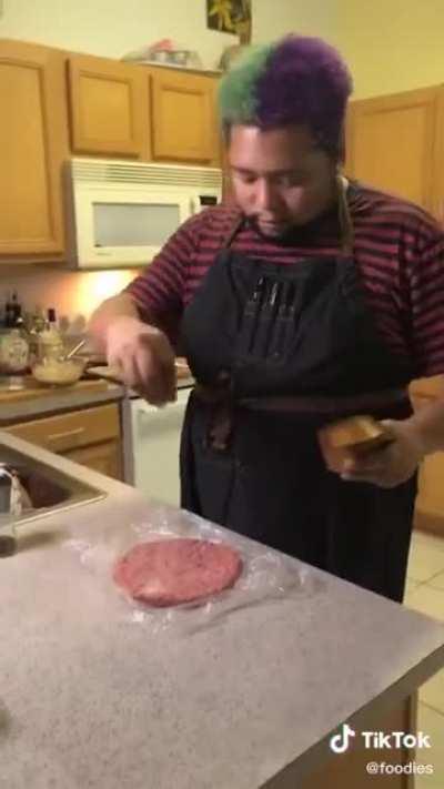 Just this dude making a comically sized burger from scratch