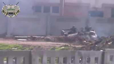 Baba Amr Brigade rifleman takes a shot at an SAA tank crew member exiting his hull-down T-72 - 6/16/2012