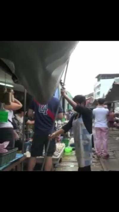 The Maeklong Railway Market AKA Umbrella pulldown market