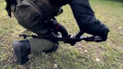 How to reload an AK-47 with an injured arm.