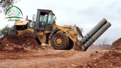 Modified front end loader turned into a Quad Barrel 